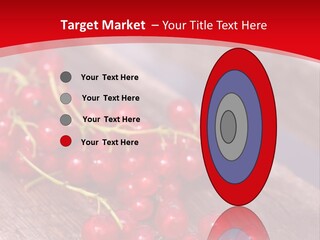 A Bunch Of Red Berries Sitting On Top Of A Wooden Table PowerPoint Template