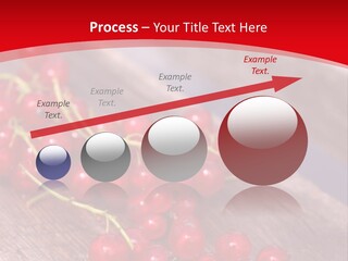 A Bunch Of Red Berries Sitting On Top Of A Wooden Table PowerPoint Template