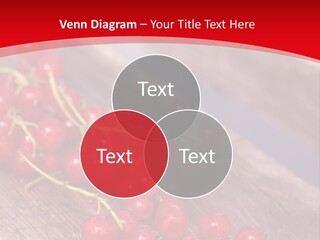 A Bunch Of Red Berries Sitting On Top Of A Wooden Table PowerPoint Template