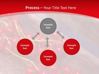 A Bunch Of Red Berries Sitting On Top Of A Wooden Table PowerPoint Template