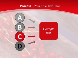 A Bunch Of Red Berries Sitting On Top Of A Wooden Table PowerPoint Template