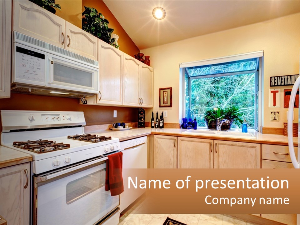 A Kitchen With White Appliances And A Window PowerPoint Template