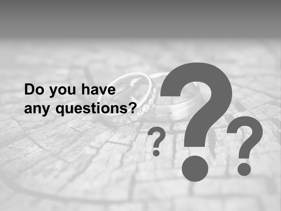 Two Wedding Rings Sitting On Top Of A Brick Floor PowerPoint Template