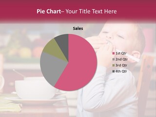 A Young Boy Is Eating A Piece Of Food PowerPoint Template