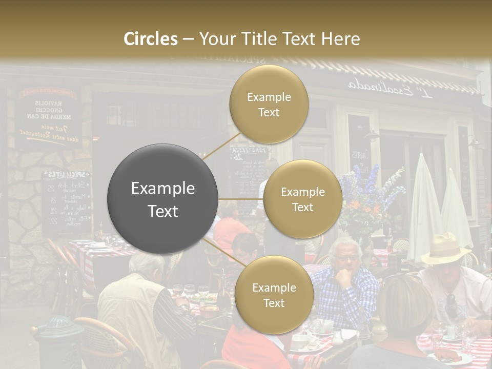 A Group Of People Sitting At A Table In Front Of A Building PowerPoint Template