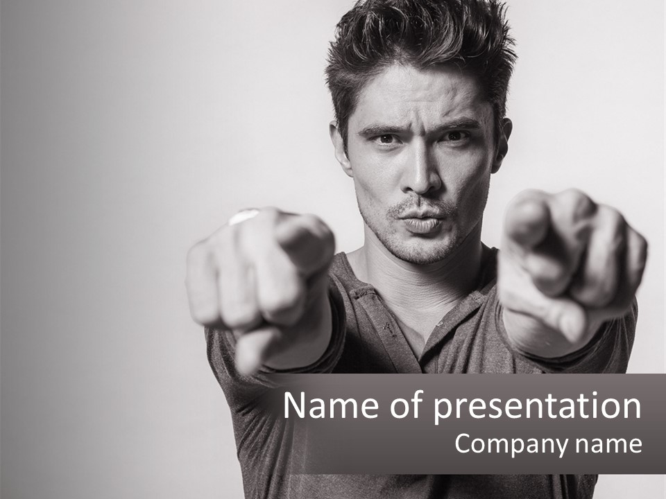 A Man Pointing His Finger At The Camera PowerPoint Template