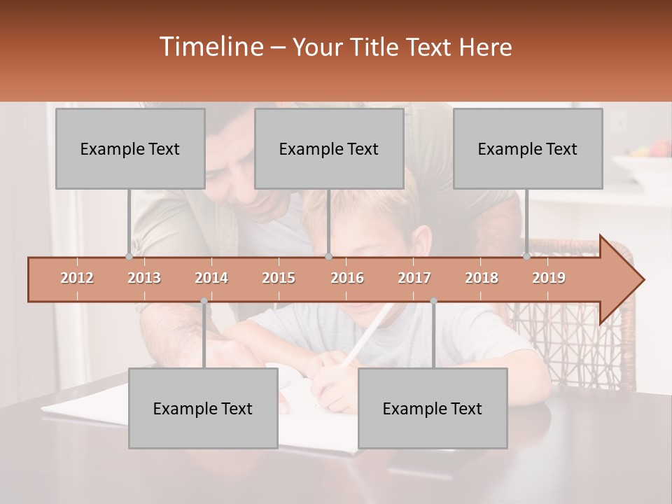 A Man Helping A Young Boy Write Something On A Piece Of Paper PowerPoint Template