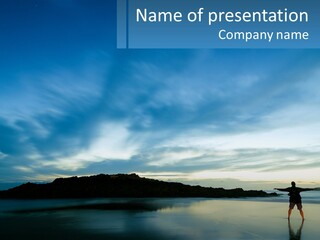 A Person Standing On A Beach With A Sky Background PowerPoint Template
