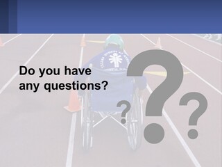 A Person In A Wheel Chair On A Race Track PowerPoint Template