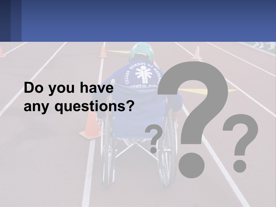 A Person In A Wheel Chair On A Race Track PowerPoint Template