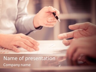 Two People Sitting At A Table With A Pen And Paper PowerPoint Template