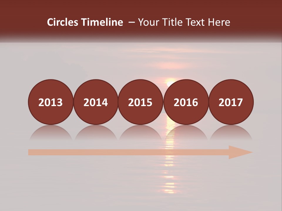 A Sunset Over A Body Of Water With Trees In The Background PowerPoint Template