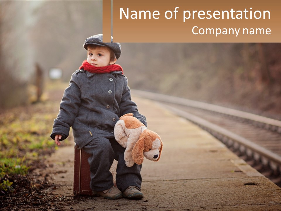 A Little Boy Sitting On A Suitcase With A Teddy Bear PowerPoint Template