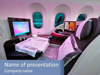 An Airplane Seat With A Table And Wine Glasses On It PowerPoint Template