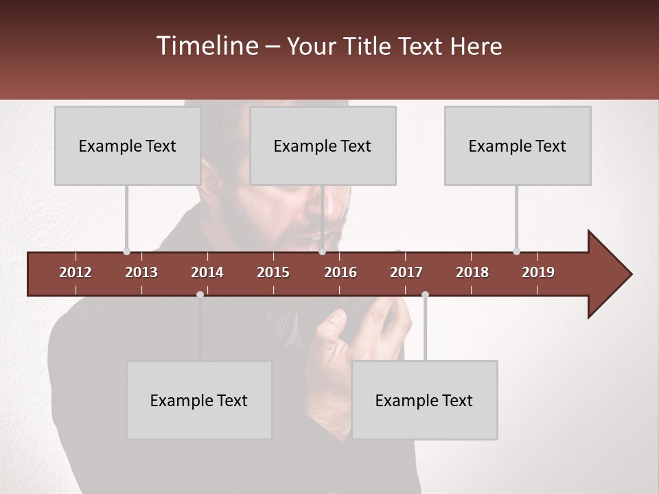 A Man Holding A Cell Phone In His Hand PowerPoint Template