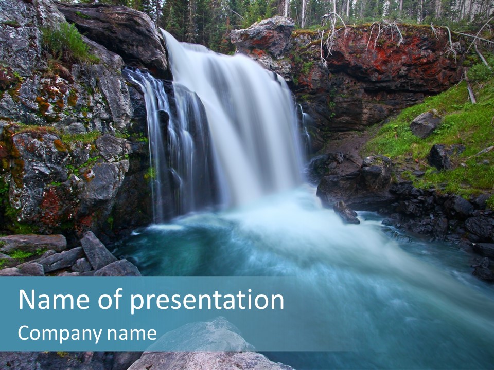A Waterfall With Blue Water In The Middle Of A Forest PowerPoint Template