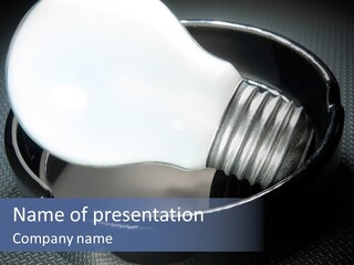 A Light Bulb In A Metal Container On A Table PowerPoint Template