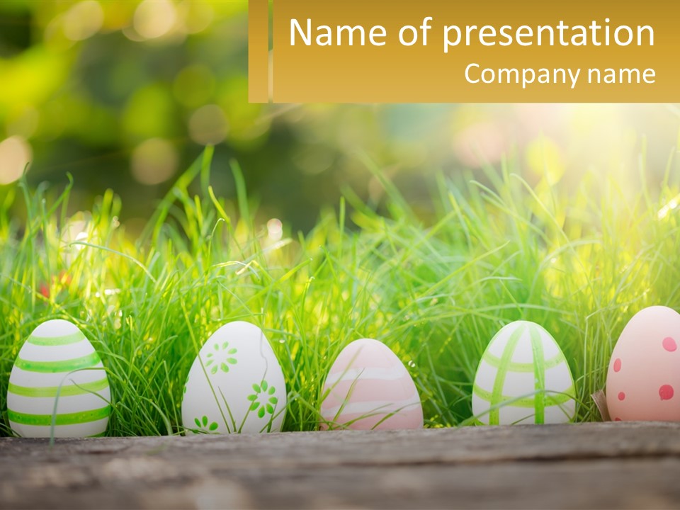 A Row Of Easter Eggs Sitting In The Grass PowerPoint Template