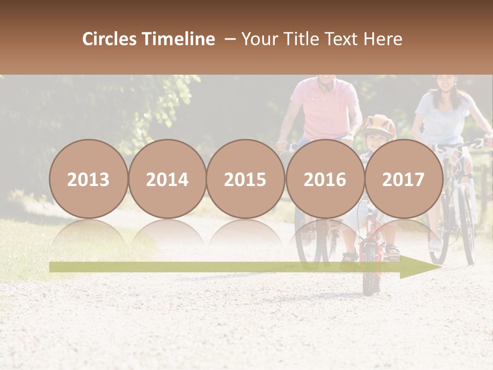 A Group Of People Riding Bikes Down A Dirt Road PowerPoint Template