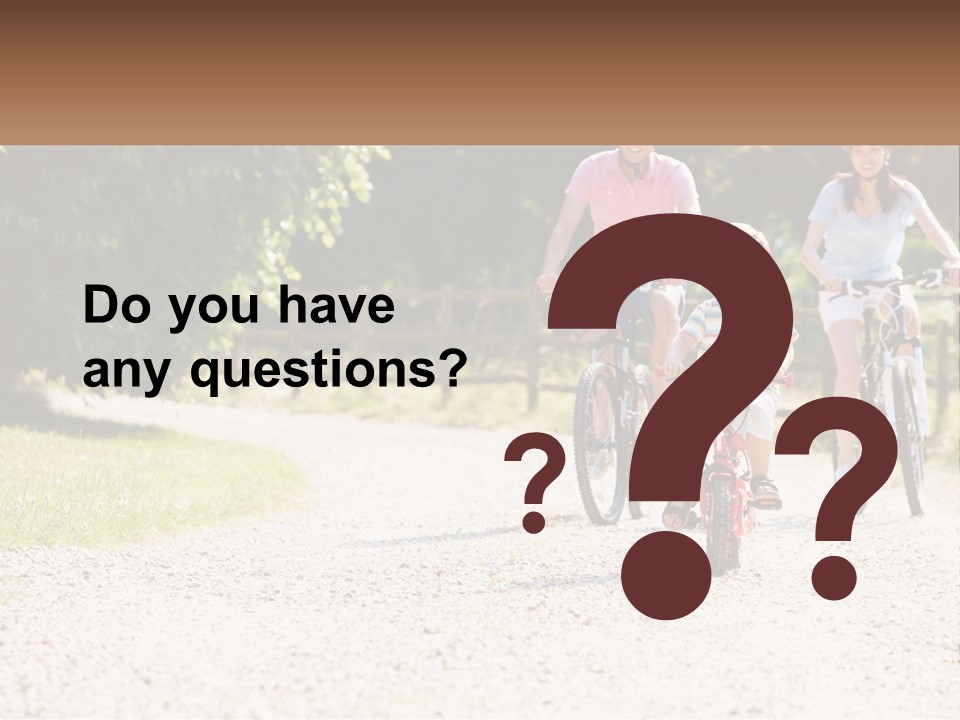 A Group Of People Riding Bikes Down A Dirt Road PowerPoint Template