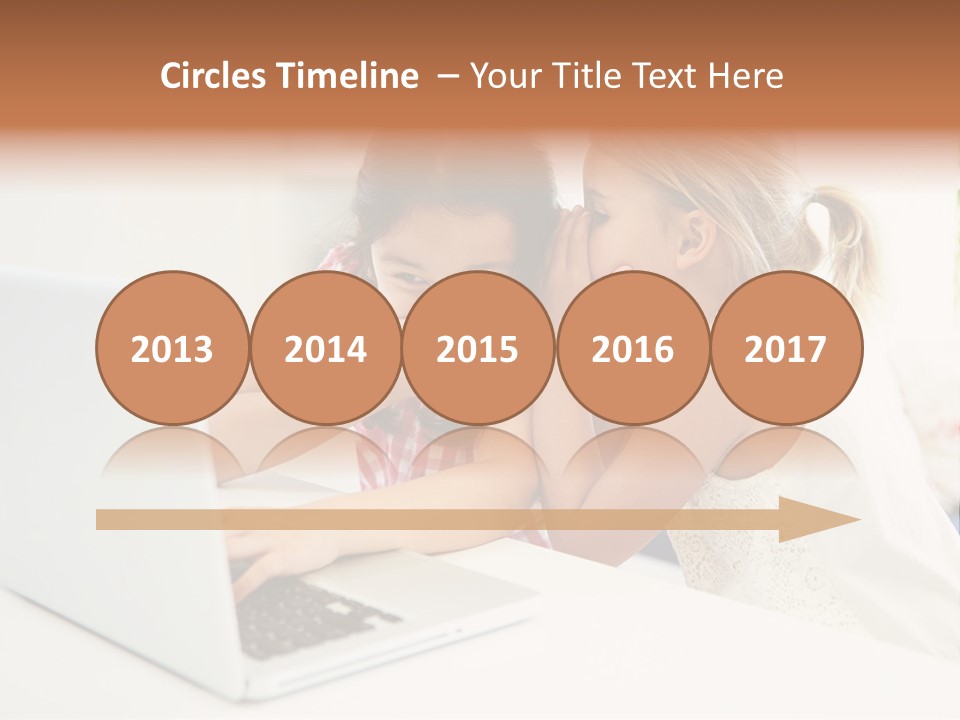 Two Young Girls Sitting In Front Of A Laptop Computer PowerPoint Template