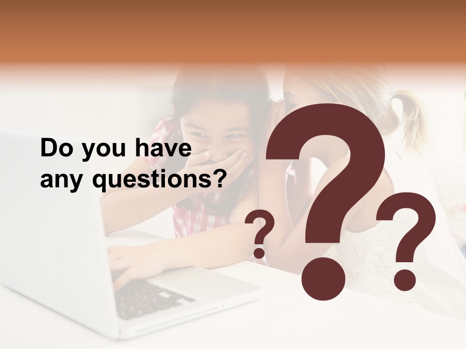 Two Young Girls Sitting In Front Of A Laptop Computer PowerPoint Template