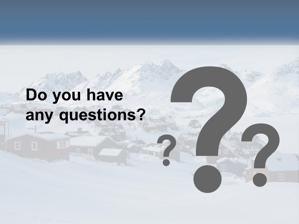 A Snowy Town With Mountains In The Background PowerPoint Template