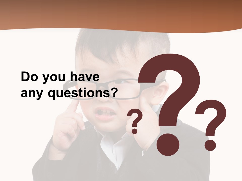 A Little Boy Wearing Glasses And A Suit PowerPoint Template