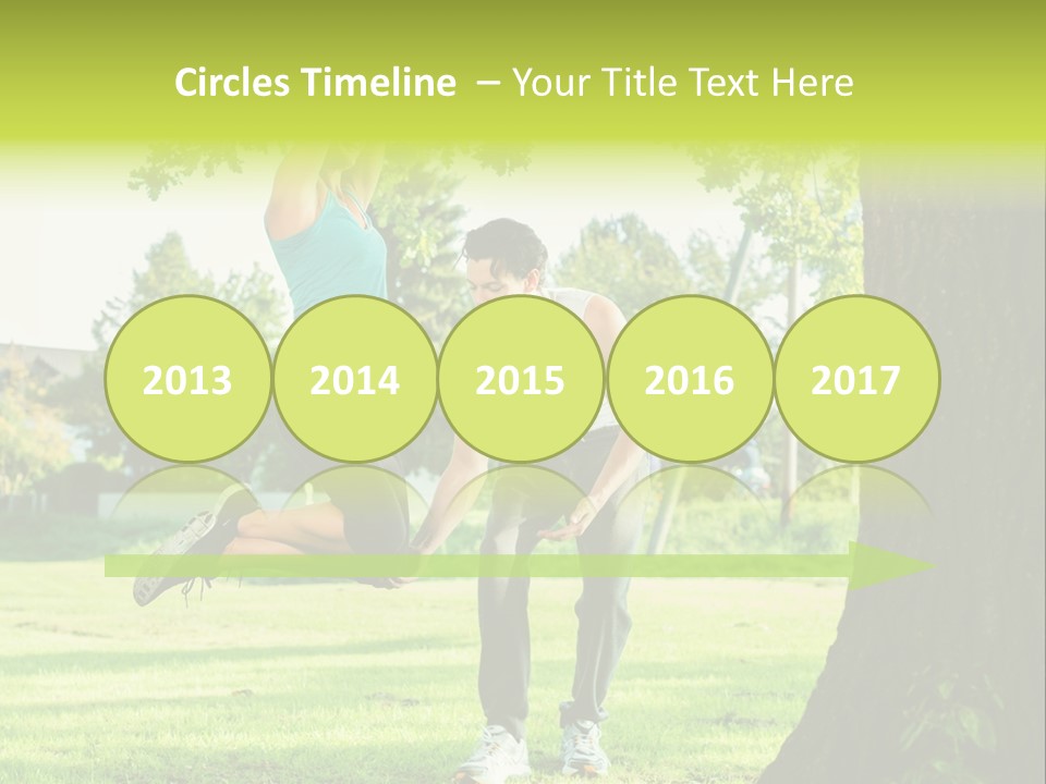 A Man And A Woman Playing With A Ball In A Park PowerPoint Template