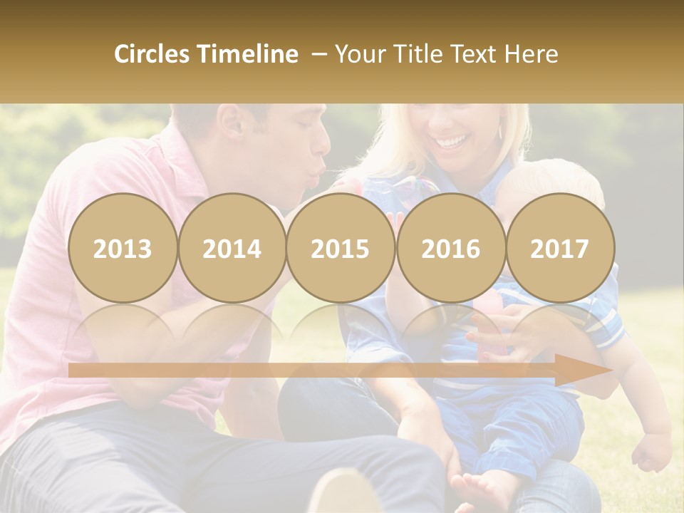 A Man And A Woman Are Sitting On The Grass With A Baby PowerPoint Template