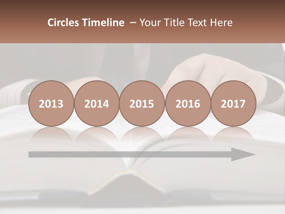 A Man In A Suit Is Pointing At A Book PowerPoint Template