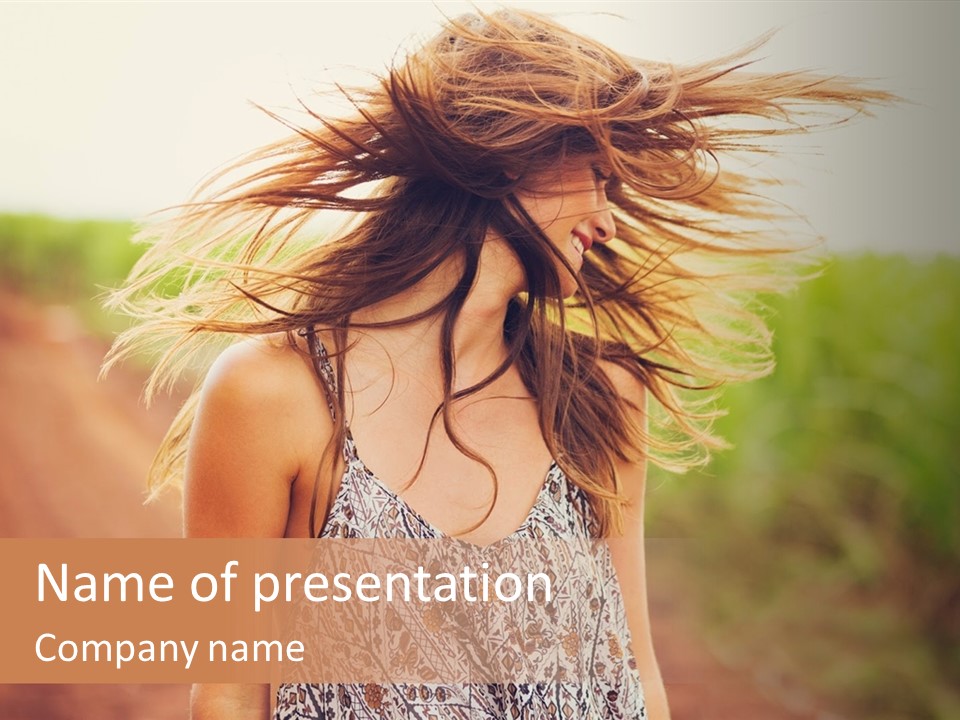 A Woman With Her Hair Blowing In The Wind PowerPoint Template