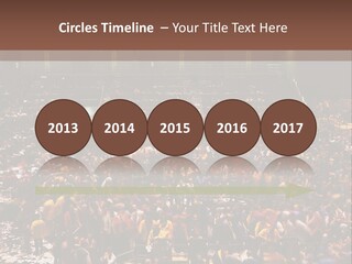 A Large Group Of People In A Large Auditorium PowerPoint Template