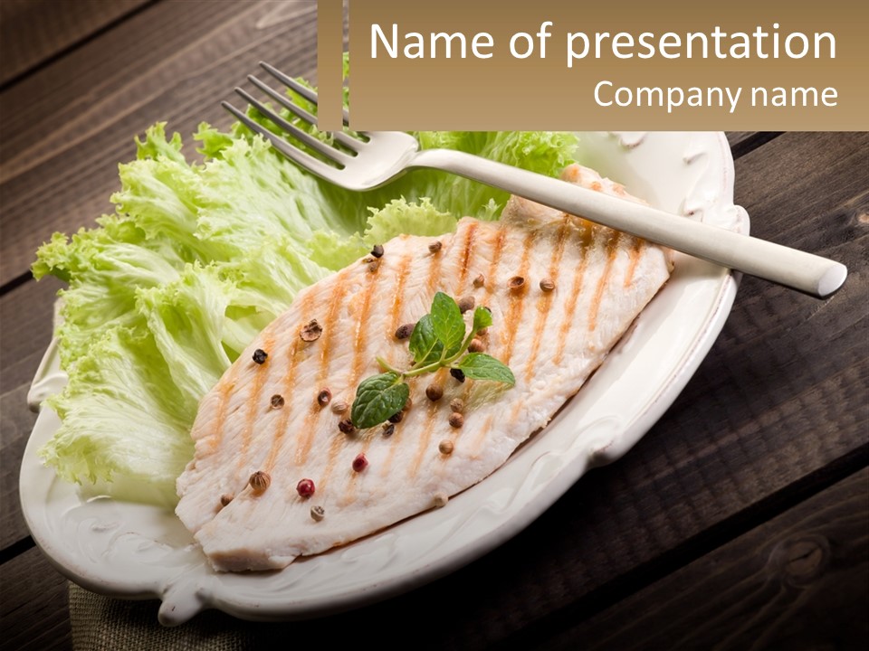 A White Plate Topped With A Piece Of Fish Next To Lettuce PowerPoint Template