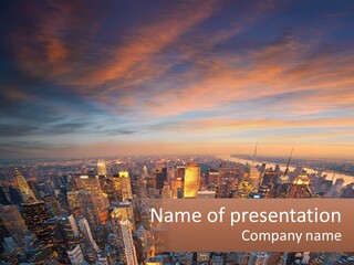 An Aerial View Of A City At Sunset PowerPoint Template