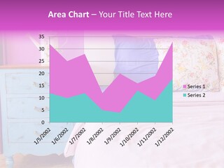 A Bed With Pillows And A Vase Of Flowers On Top Of It PowerPoint Template