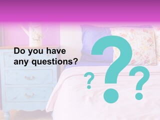 A Bed With Pillows And A Vase Of Flowers On Top Of It PowerPoint Template