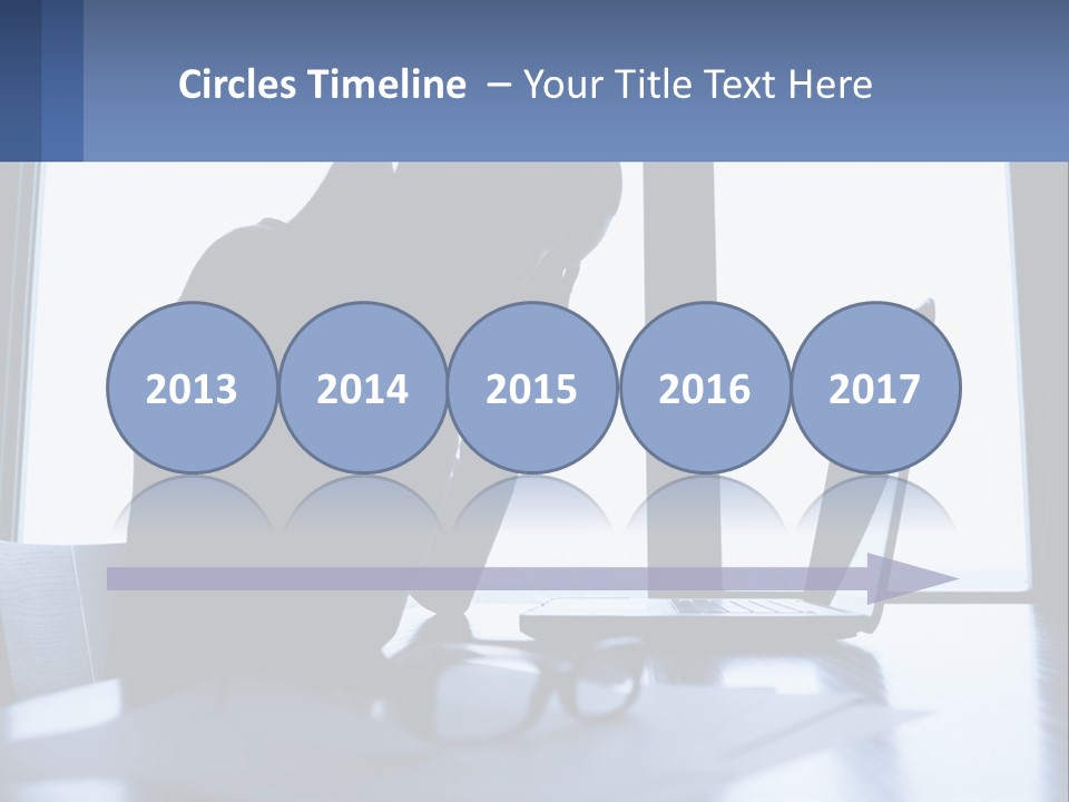 A Woman Sitting In Front Of A Laptop Computer PowerPoint Template