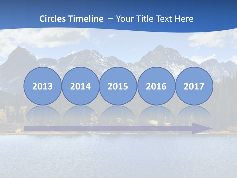 A Lake Surrounded By Trees And Mountains In The Background PowerPoint Template