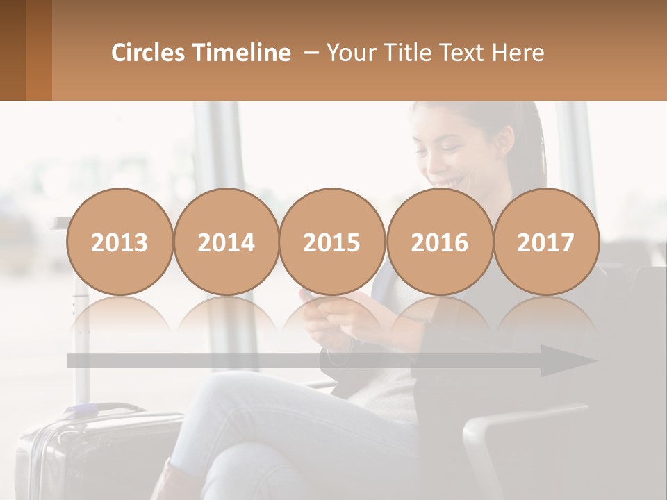 A Woman Sitting In A Chair Looking At Her Cell Phone PowerPoint Template