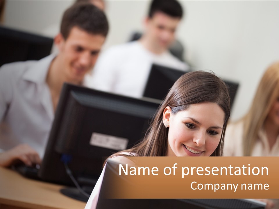 A Group Of People Working On Computers In An Office PowerPoint Template