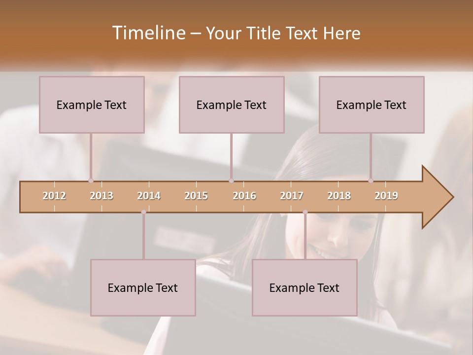 A Group Of People Working On Computers In An Office PowerPoint Template
