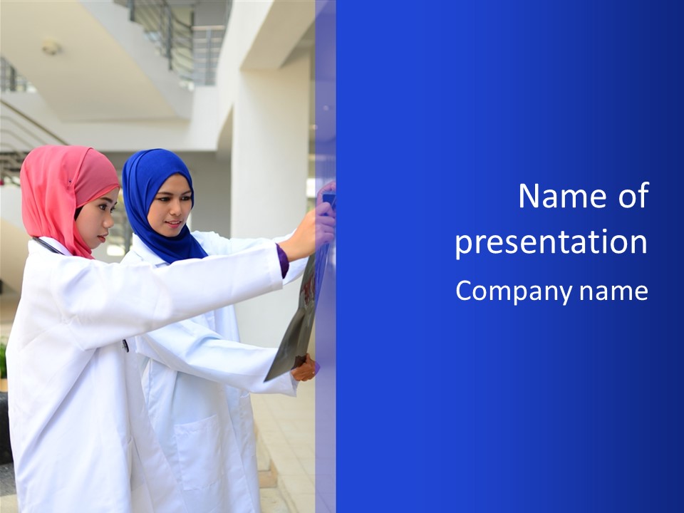 Two Women In Hijabs Are Looking At Something PowerPoint Template