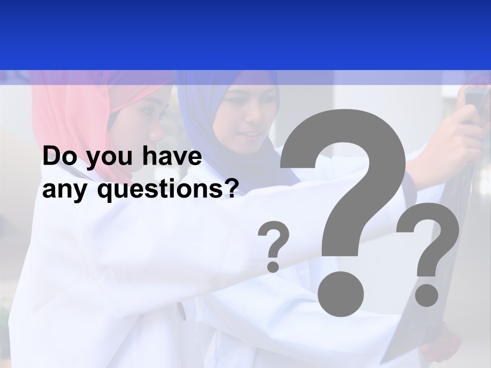 Two Women In Hijabs Are Looking At Something PowerPoint Template