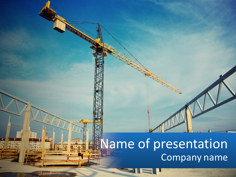 A Crane That Is On Top Of A Building PowerPoint Template