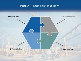 A Crane That Is On Top Of A Building PowerPoint Template