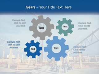 A Crane That Is On Top Of A Building PowerPoint Template