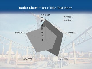 A Crane That Is On Top Of A Building PowerPoint Template
