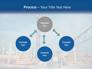 A Crane That Is On Top Of A Building PowerPoint Template