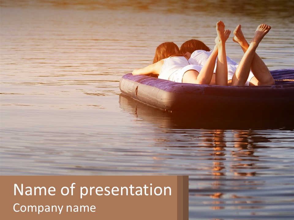 Two People Are Floating On A Raft In The Water PowerPoint Template